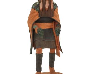 1208 Nelson Kuwanvana (b. 20th century, Hopi-Tewa) A painted carved cottonwood 'Long Hair Girl' katsina, 1986 Signed, dated, and titled to underside: NELSON KUWANVANA / "86" The Angak'china Mana depicted with pine boughs Overall: 12.5" H x 4.625" W x 4.125" D Estimate: $300 - $500