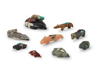 1362 A group of Zuni carved stone fetish animals Mid/late 20th century, mostly Zuni Pueblo Most variously incised with initials or artist's cipher Comprising nine mammalian figures, including one amber by Georgianne Quandelacy, two carved jet, and six carved hardstone, most with inset turquoise or coral eyes, each mounted with offerings 9 pieces Largest: 1.75" H x 3.625" W x 2.875" D; Smallest: 0.5" H x 1.625" W x 0.875" D Estimate: $200 - $400