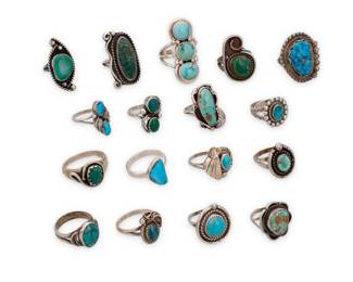 1409 A group of Southwest style silver and turquoise rings Mid/late 20th century Nine variously marked for maker and/or for sterling: Effie C. Zuni [for Effie Calavaza, 1927-2019] / SW / RH / SS / Mexico [Eagle 57] / JP Comprising a triple set and two double set turquoise rings as well as fourteen single set turquoise rings in various colors, sizes, and styles, including stamp work accents and silver feather and twisted wire overlay and edge accents 17 pieces Ring sizes: 9 to 4 89.9 grams gross Estimate: $300 - $500