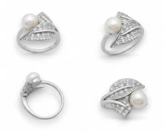 Ring featuring a decorative leaf motif embellished with paveset clear stones an