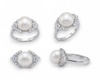 Ring featuring central round white pearl with leafinspired shoulders set with s