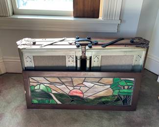 The stained glass is not intact on this casket bier 