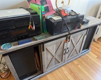 Rustic Gray Wood Media Console with Sliding Barn Doors and Audio Equipment
