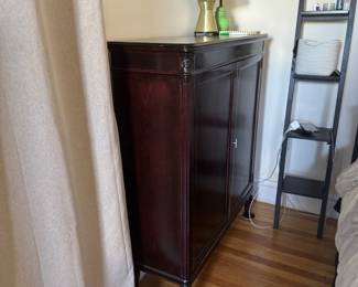 Dark Wood Sideboard with Decorative Panels and Turned Legs