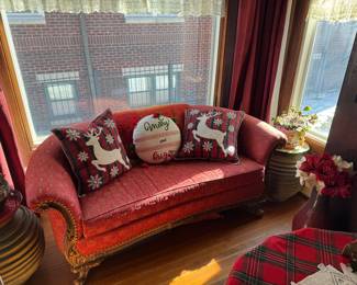Curved Red Upholstered Settee with Carved Wood Legs