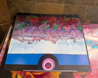 Abstract landscape with pink textures and a circular focal point.