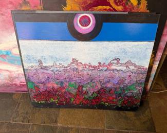 Abstract landscape with pink textures and a circular focal point.