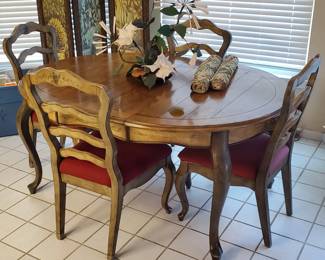 Table with 4 chairs and leaf. Matching hutch in the blue room.