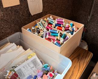 Assorted Embroidery Floss, Sewing Threads, and Cross-Stitch Patterns