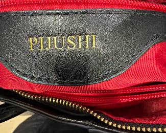 Ladies Leather handbag by Pijushi