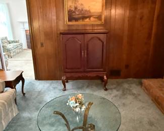 Storage chest, glass top table, picture