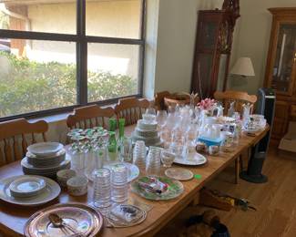 Gorgeous dining table with four leaves, six chairs, and so much glassware
