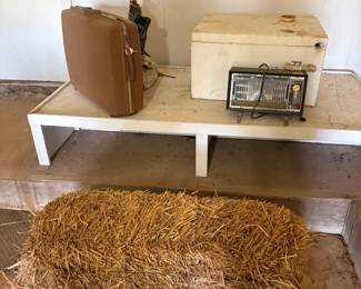 luggage, wood box, space heater, straw