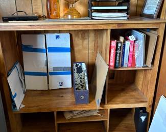 ET center, glass and other framing supplies, books, oil lamp