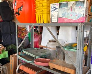 Large pumpkin, metal shelving, stadium seats, 