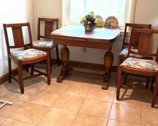 early 1900's oak pub table and 4 chairs