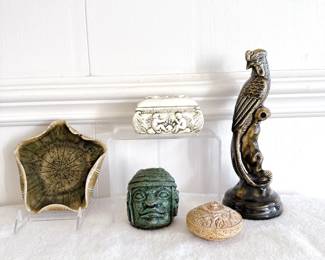 thai celadon green bird of paradise figurine, decorative carved stone trinket box, colossal olmec head sculpture crushed green stone, lidded trinket box porcelain raised relief scene cherubs, decorative star shaped ceramic pottery dish green