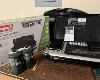 Brand new Coleman camp grill/stove with carrying case