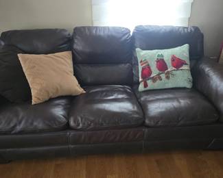 2 brown leather couchs 