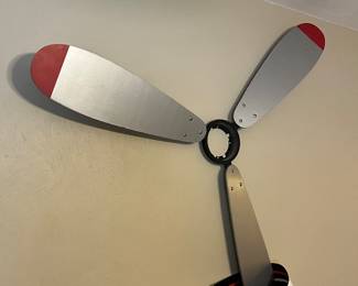 overhead airplane fan blades have the motor and cover
