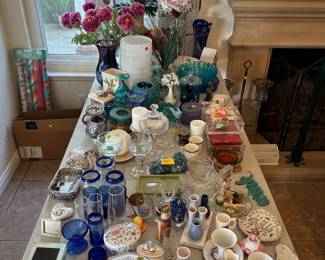 Blue and teal glassware, fake plants