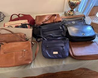 Assorted designer purses. 