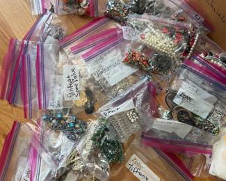 Costume jewelry including Tiffany rattle and silver pieces