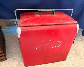 Vintage Coca-Cola red metal cooler with chrome handle, retro advertising collectible