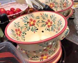 Hand-painted ceramic bowl, floral design, stacked plates, kitchen utensils, dinnerware lot