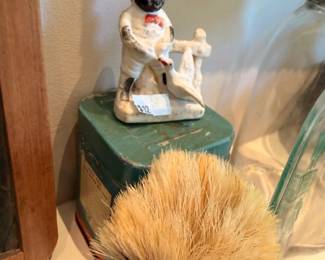 Vintage hand-painted ceramic figurine on hay bale, collectible pottery