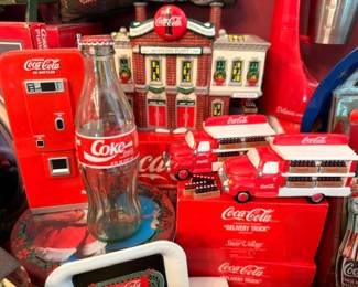 Coca-Cola collectibles lot, Coke delivery trucks, village buildings, vintage bottles, memorabilia