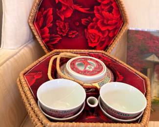 Vintage wicker picnic basket set with red satin lining and china cups