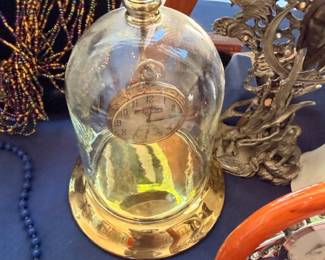Brass anniversary clock under glass dome cloche
