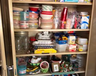 Pantry cabinet full of cleaning supplies, household chemicals paper goods, garage storage lot