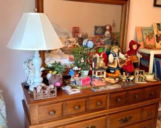 Vintage oak dresser with mirror, table lamp, collectible figurines, Christmas decor