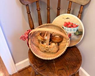 Antique spindle-back wooden chair, wicker basket, decorative plate