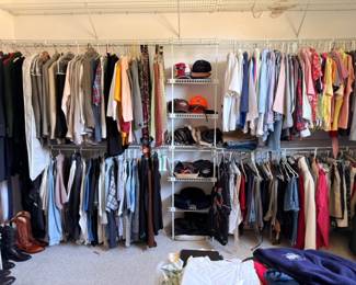 Men's clothing closet, shirts jackets pants on hangers, full wardrobe lot