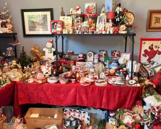 Christmas collectibles table overview, nutcrackers, figurines, Santa decor, holiday lot