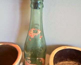 Vintage green glass bottle with pour spout, stoneware crocks