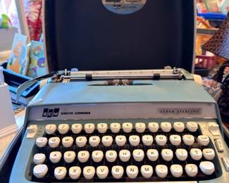 SCM Smith Corona typewriter close-up in carrying case, vintage portable typewriter