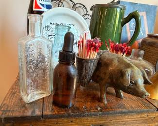 Cast iron pig figurine, antique glass bottles, green ceramic pitcher, farmhouse collectibles lot