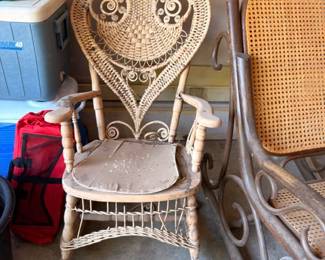 Ornate white wicker Victorian chair, heart-shaped back, scrollwork patio furniture