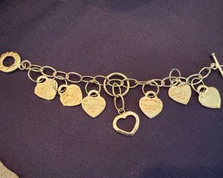 Gold tone heart charm bracelet with engraved disc charms, vintage souvenir jewelry collectible