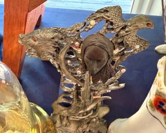 Silver-tone eagle sculpture on ornate base