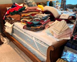 Massive clothing and linens lot, bed full of textiles, blankets, vintage clothing collection