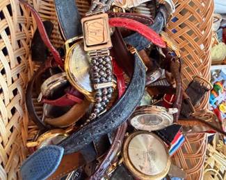 Basket of vintage watches with leather and metal bands