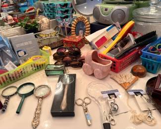 Junk drawer lot, magnifying glass, sunglasses, keychains, figurines, smalls collectibles