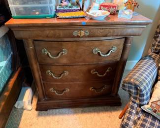 Dark wood three-drawer dresser chest, ornate brass bail handles, vintage bedroom furniture