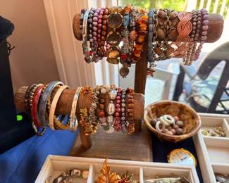 Beaded bracelets and bangles on display stand, costume jewelry collection