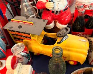 Coca-Cola yellow pedal truck toy, vintage Coke Refreshing sign, collectible memorabilia display